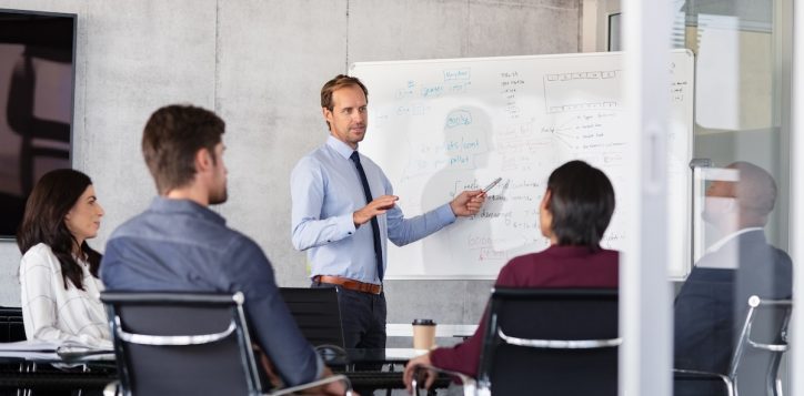 businessman-giving-presentation-with-colleagues-2